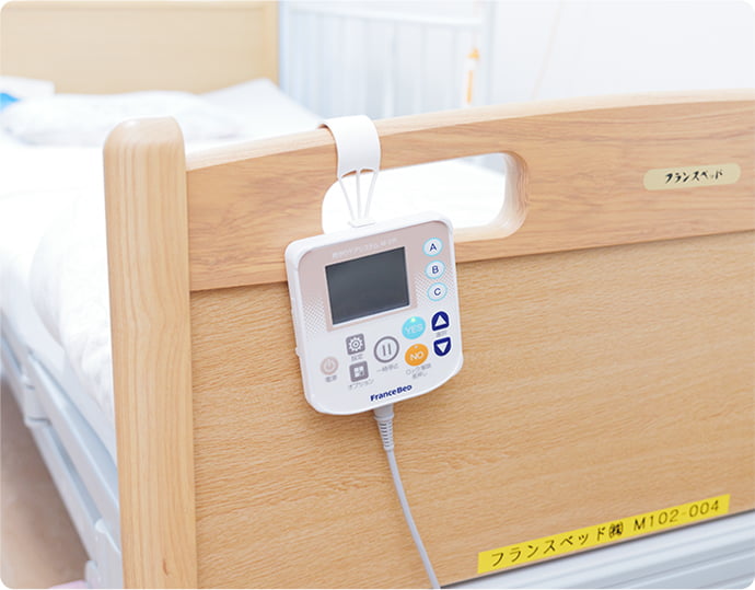 写真：見守りケアシステムM-2 リモコン